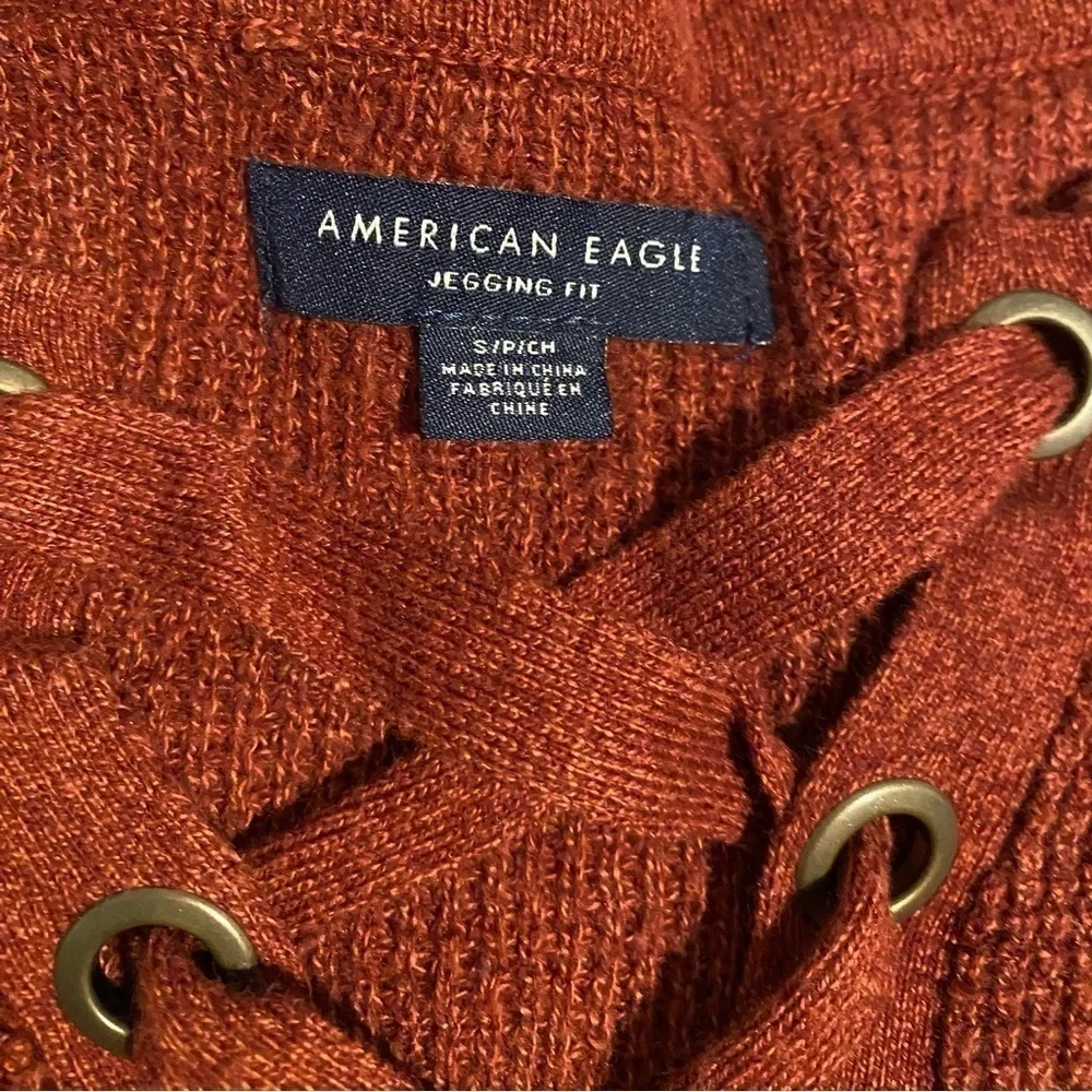 American Eagle size small jegging fit crimson rust color cross tie knit sweater